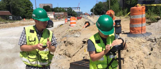 Professional Surveyor Dustin Addair, PS lays out and stakes the Opportunity Corridor in Cleveland, Ohio.